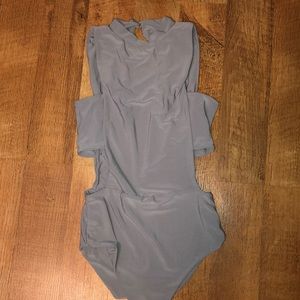 Body suit with side cut outs